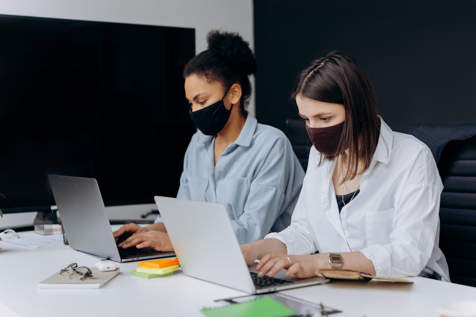 State Department employees working in office with masks