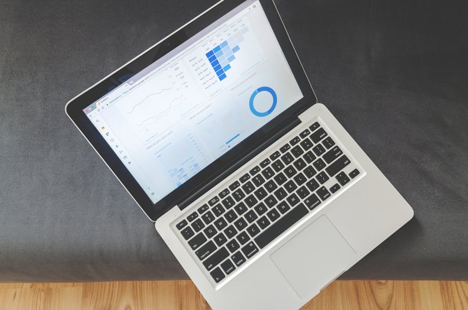 business professional analyzing data dashboard on computer