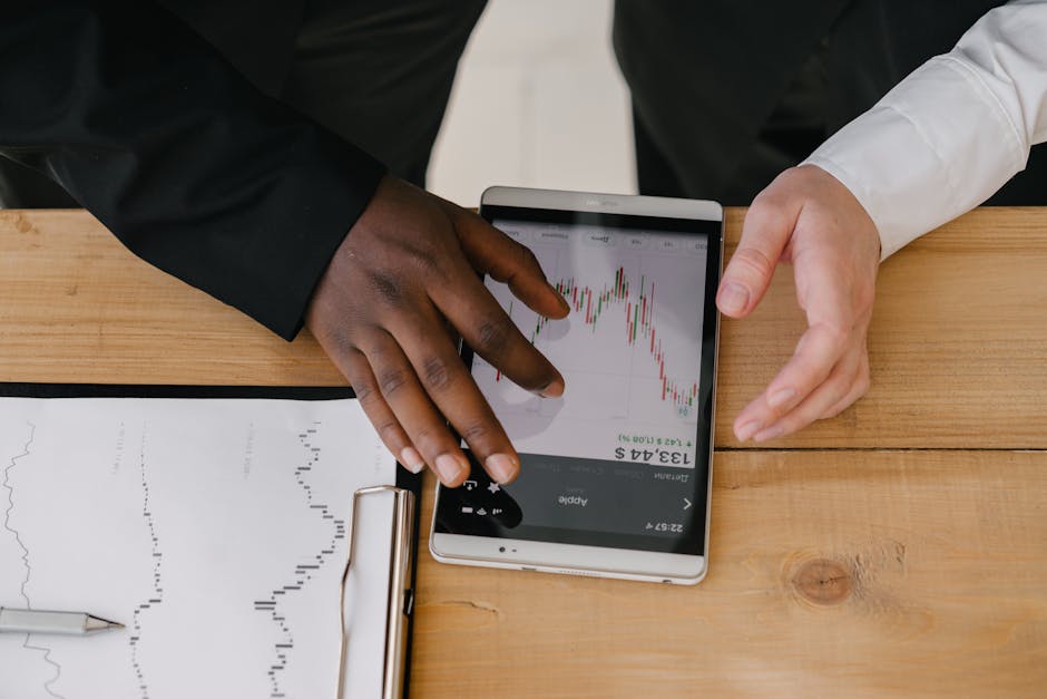 business professionals analyzing financial data on computer