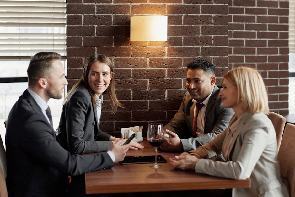 business professionals engaged in conversation over lunch