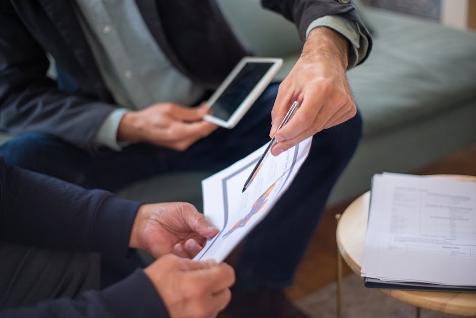 business professionals reviewing contract documents