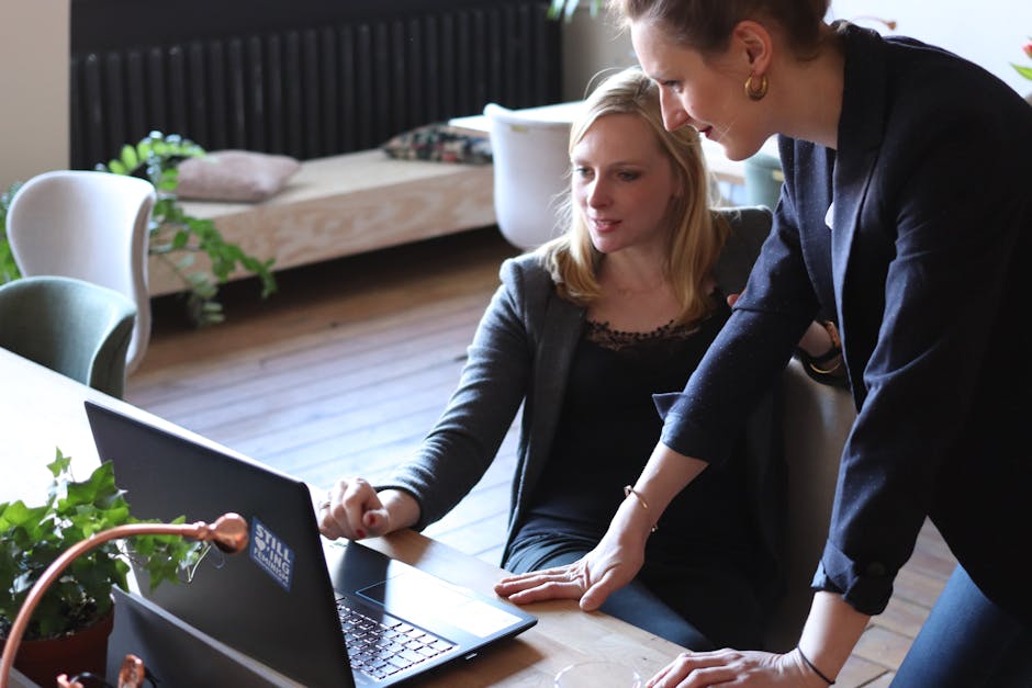 colleagues collaborating near a wayfinding kiosk