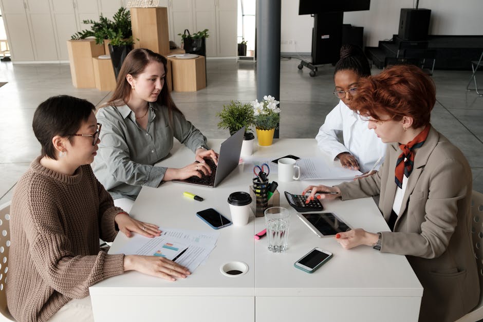 diverse team collaborating in modern office with digital tools