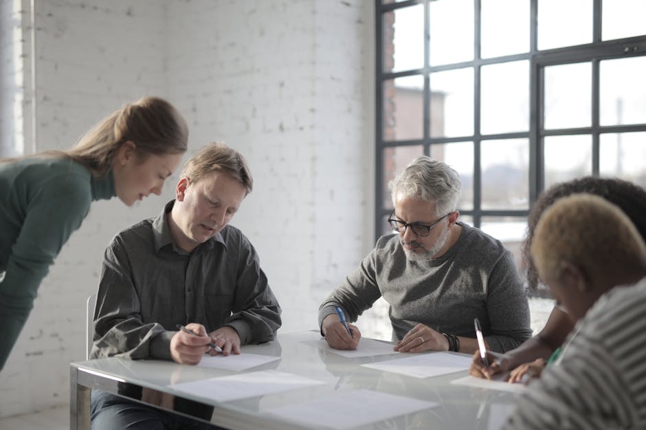 diverse team collaborating in office and remotely