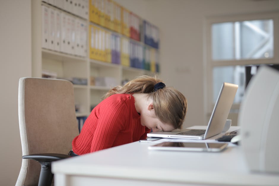 employee meditating at desk