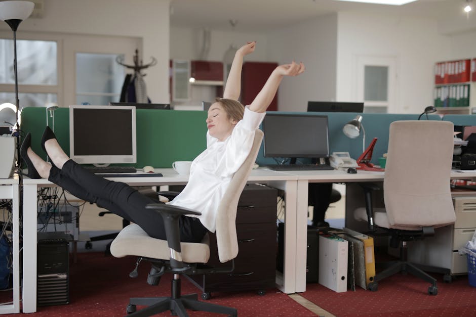 employee stretching at desk