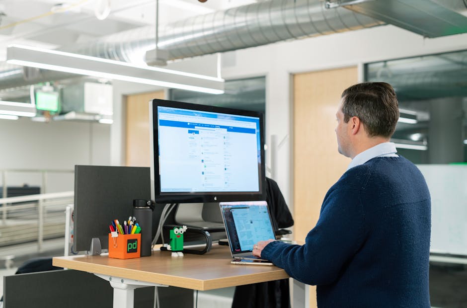 employee using a standing desk or treadmill desk