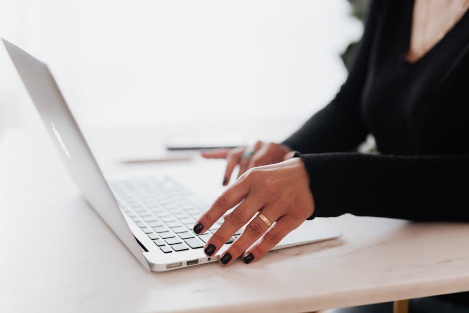 employee using laptop in modern office