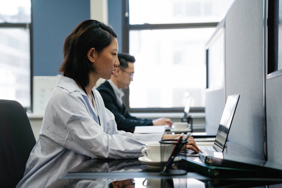 employee working at flexible desk office space