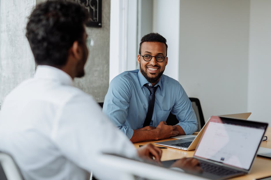 employees collaborating at hot desks