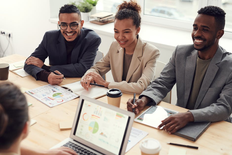 employees collaborating in a modern office breakout area