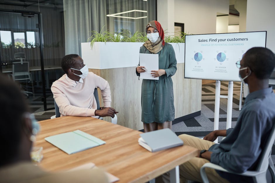 employees collaborating in a socially distanced office