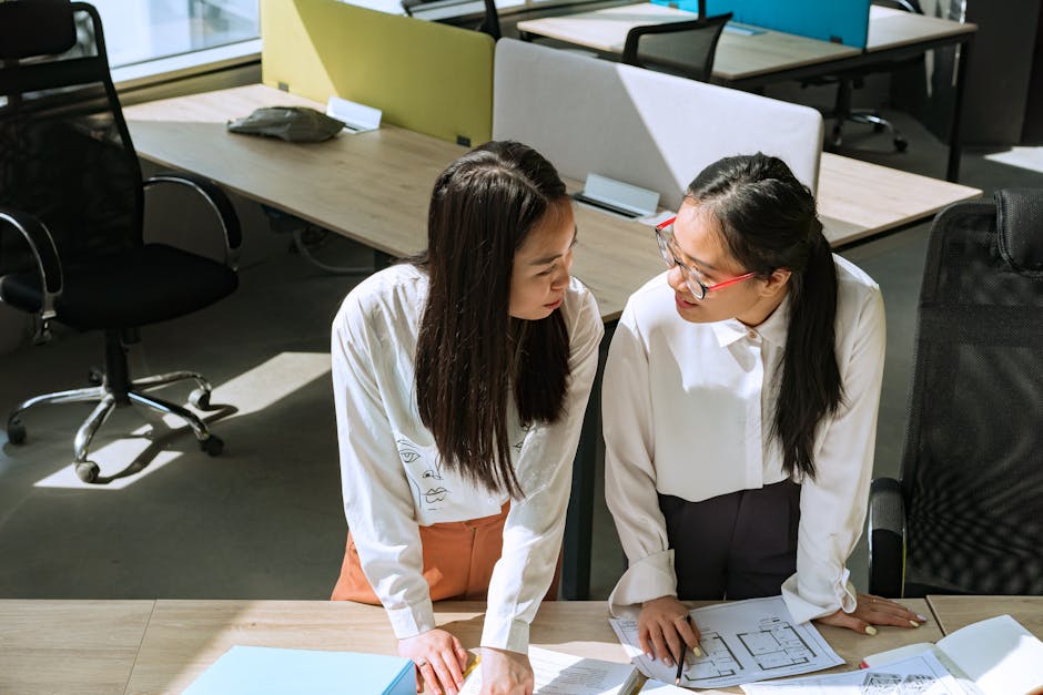 employees collaborating in an open office neighborhood