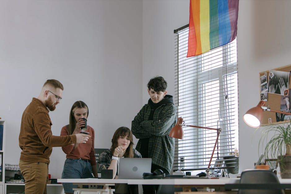 employees collaborating in small office space