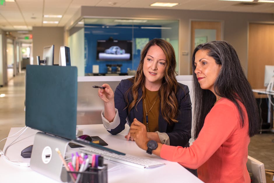 employees collaborating using large touch screen monitor