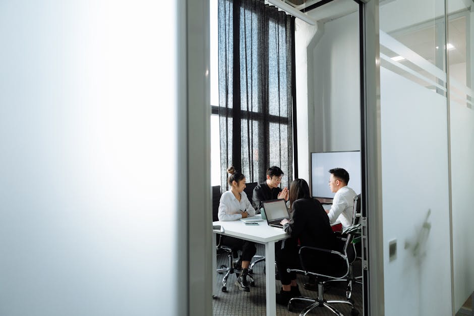 employees discussing goals in a meeting room