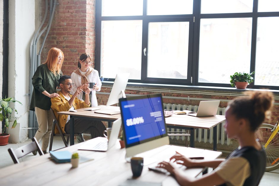 employees doing yoga in office space