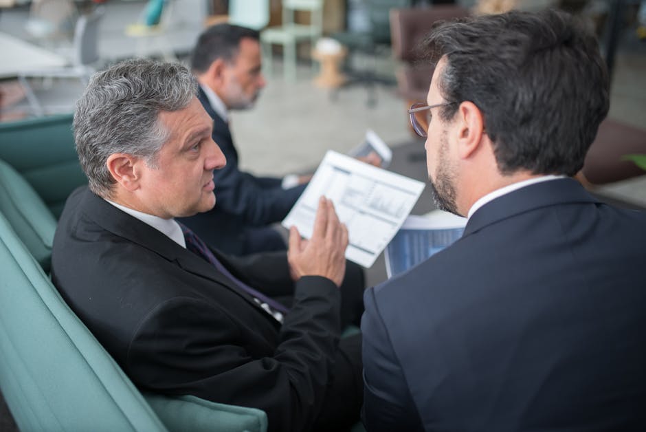 employees sharing desks in modern office