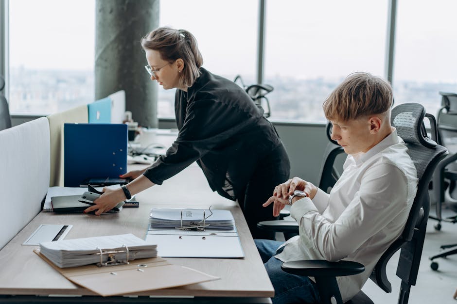 employees working at adjustable standing desks