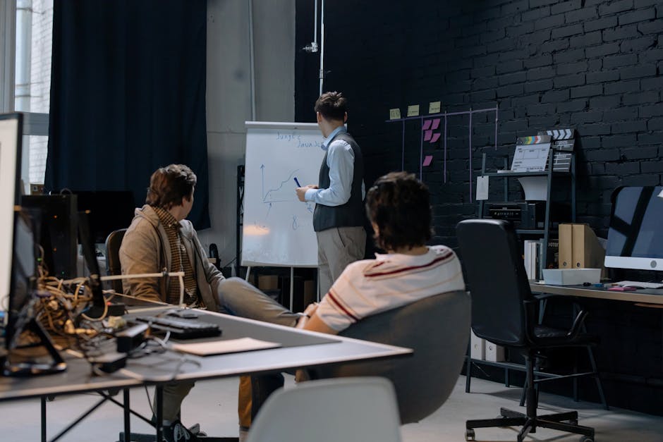 employees working at hot desks in modern office