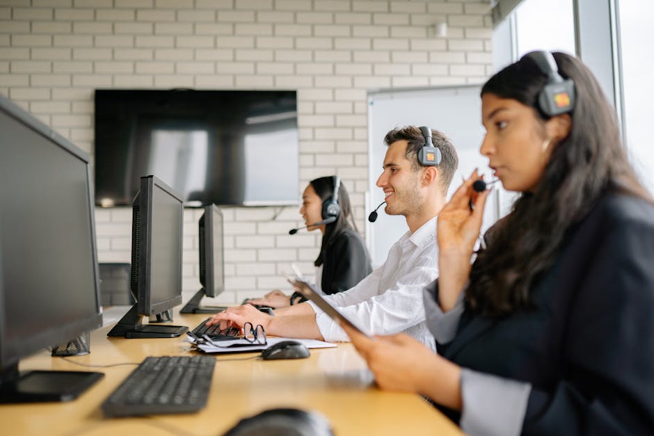 employees working together in hybrid office setting