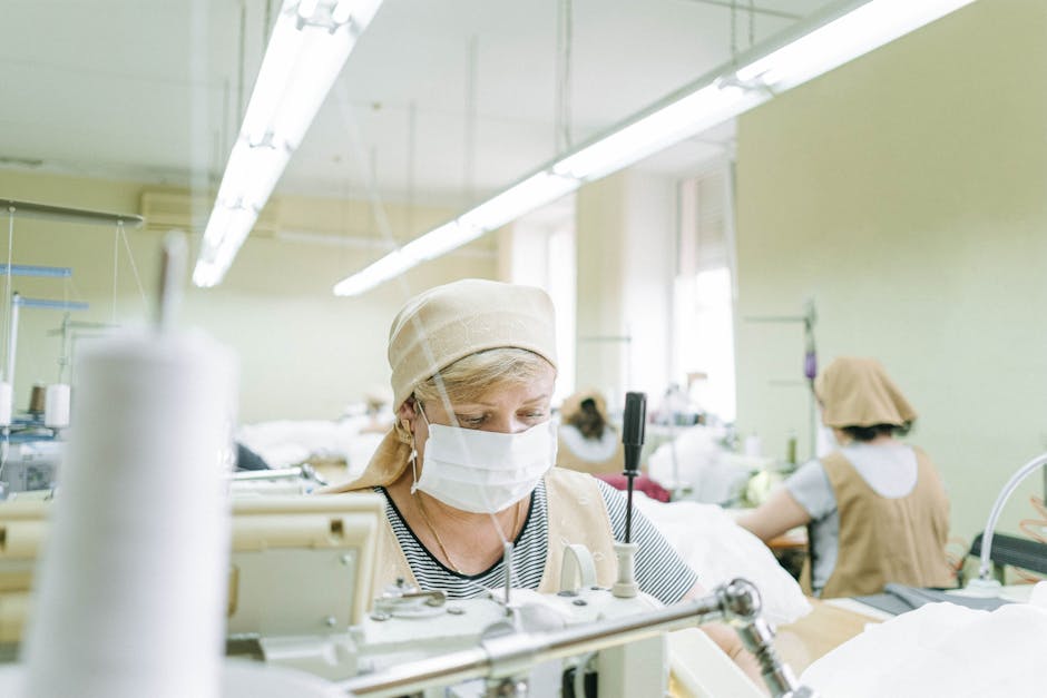 manufacturing plant worker wearing safety gear