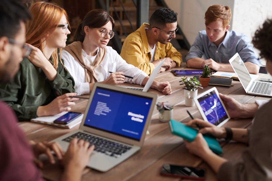 modern office with people working on laptops