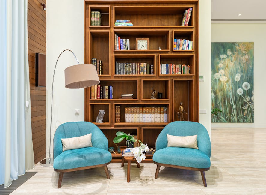 office library with bookshelves and comfortable seating
