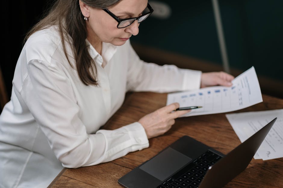 office manager analyzing room usage data on computer