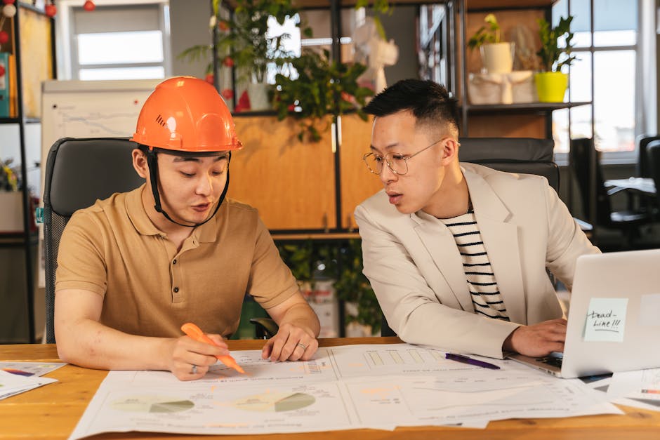 office manager reviewing visitor check-in system dashboard