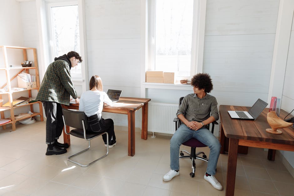 office workers laughing in meeting room