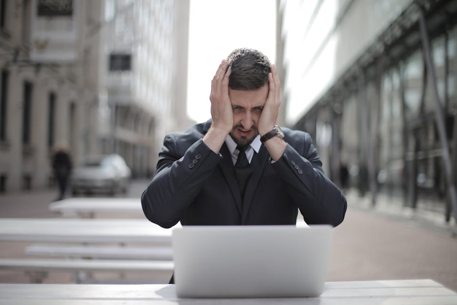 overwhelmed employee at computer