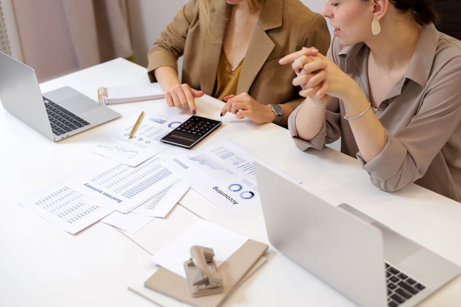 people collaborating in modern office with digital displays