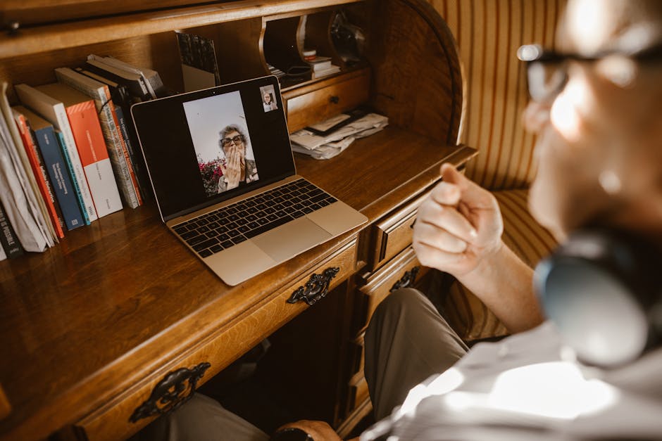 people having a virtual meeting on laptop
