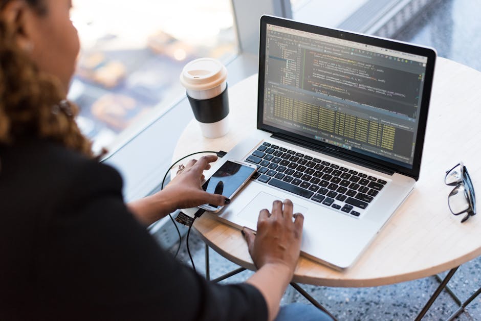 person analyzing visitor data on computer screen