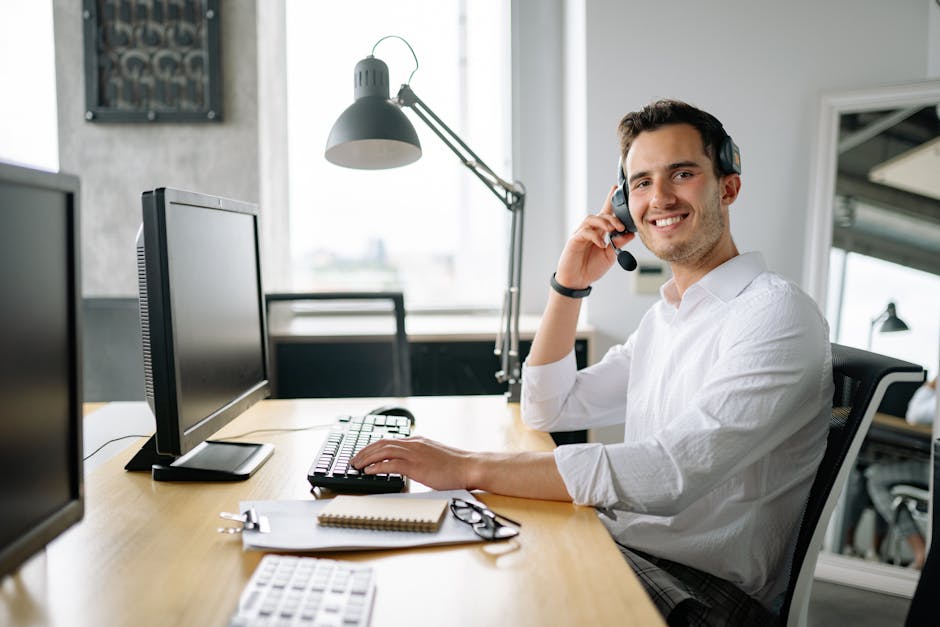person using assistive technology at computer workstation