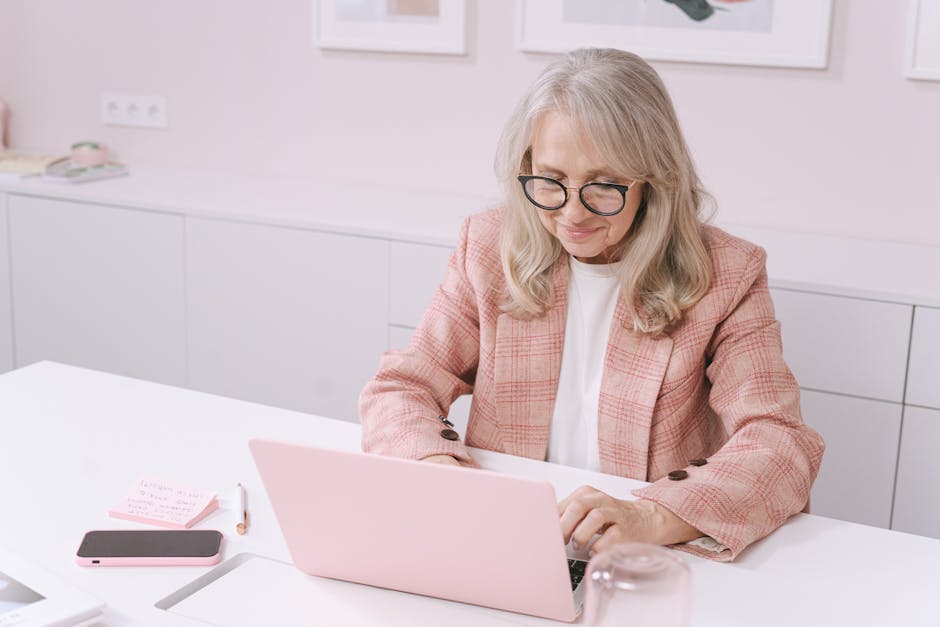 person using multiple screens and devices