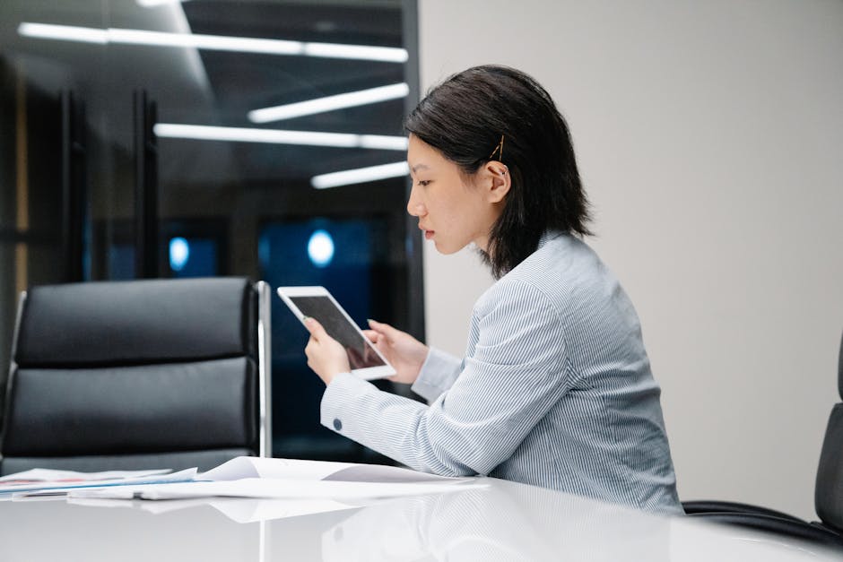 person using tablet for office space management