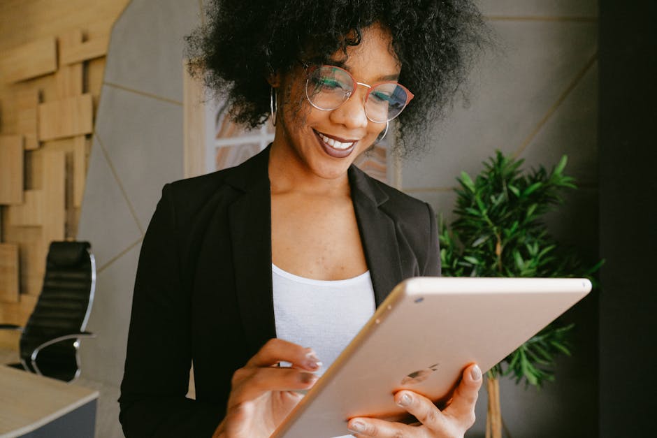 person using tablet for workplace management