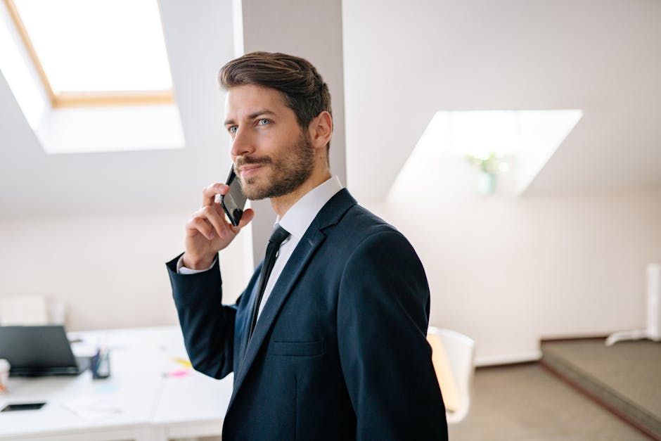 professional putting away phone during meeting