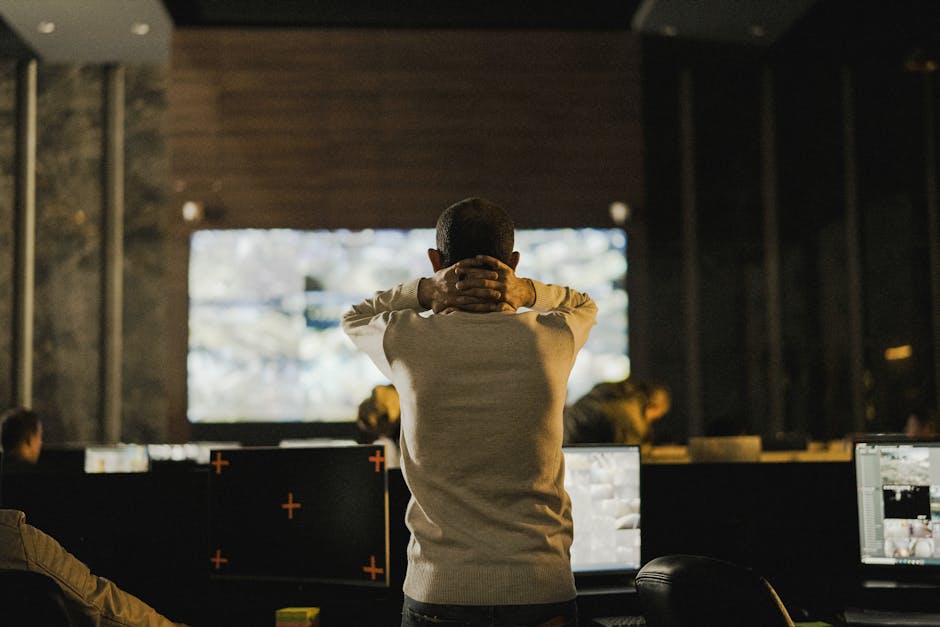 security professional monitoring surveillance screens