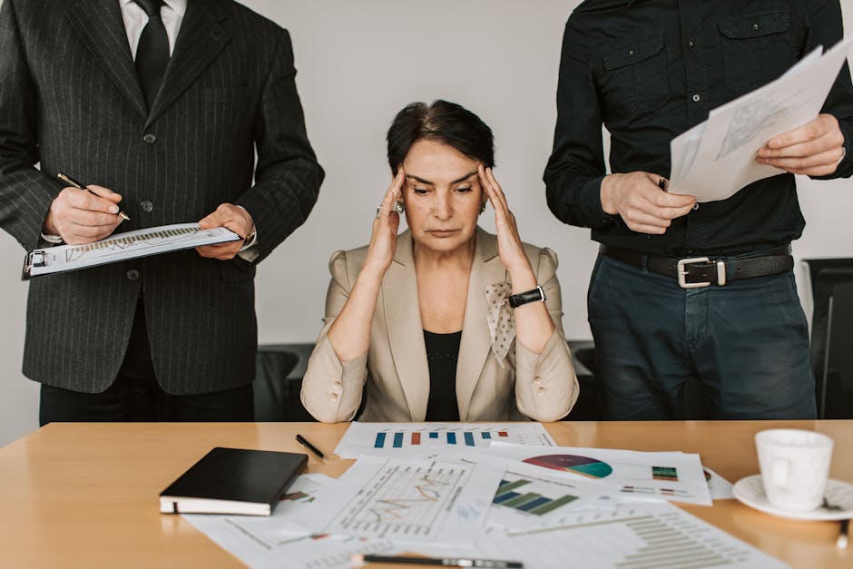 stressed employees in office meeting