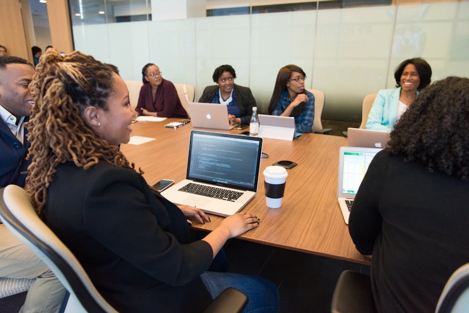 team meeting in conference room with inspiring name