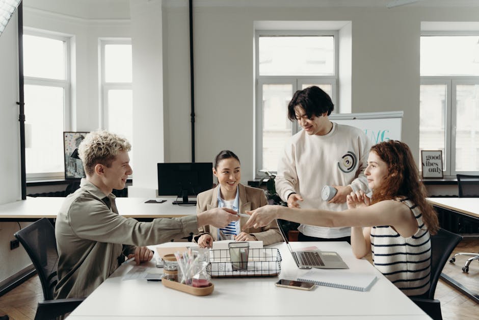 team members discussing project in open office