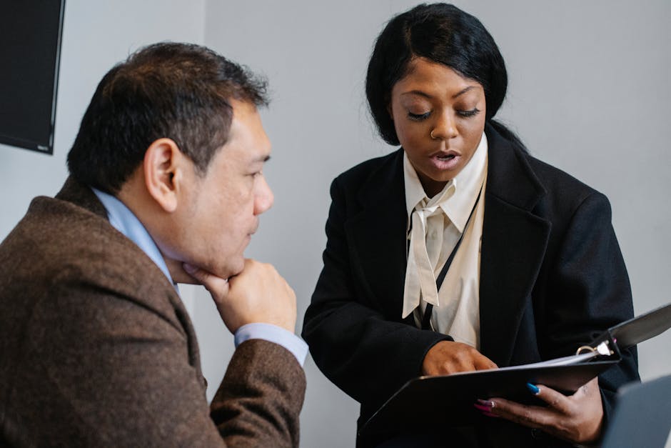 young employee receiving mentorship from senior colleague